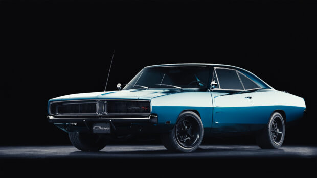 Classic Dodge Charger in blue and white color captured in studio lighting against black background