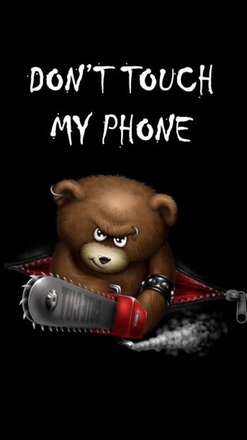 Angry bear holding a chainsaw with dont touch my phone phrase in a dark background