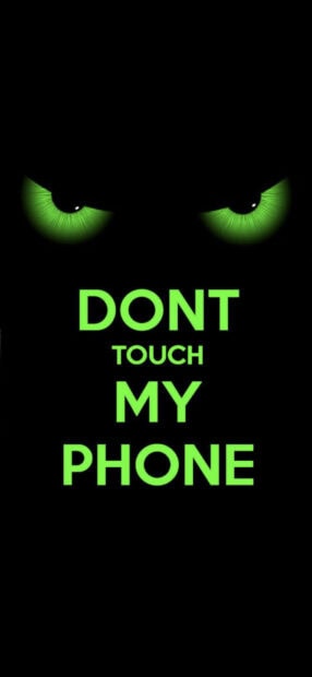 Green glowing eyes with dont touch my phone text on dark background