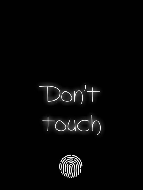 A glowing dont touch text with a fingerprint icon on black background