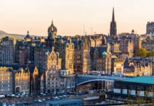 Historic Edinburgh Scotland cityscape with old stone buildings and bridges at sunset