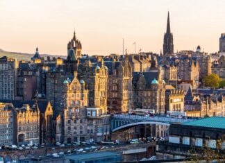 Historic Edinburgh Scotland cityscape with old stone buildings and bridges at sunset
