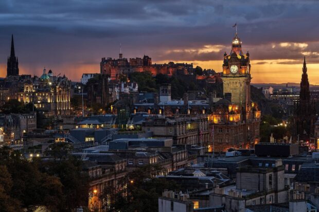 Edinburgh city skyline at sunset with historic buildings and castle in Scotland