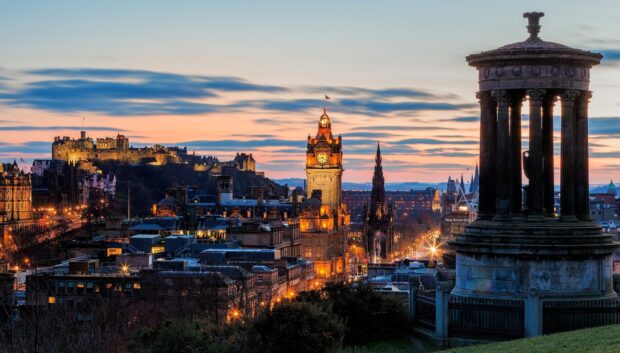 Historic Edinburgh Scotland skyline at sunset with the Dugald Stewart monument in the foreground