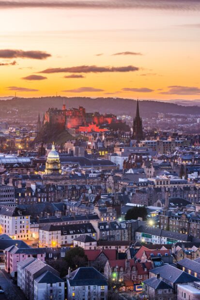Historic Edinburgh Scotland cityscape at sunset with castle and old buildings visible