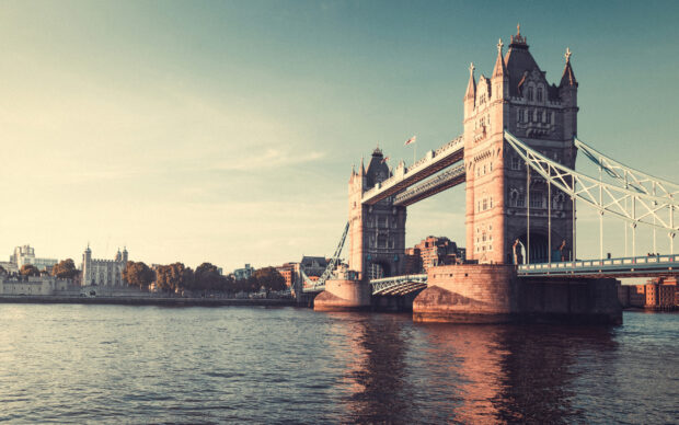 England Wallpaper 2K Desktop Tower bridge is a famous landmark representing England with detailed architecture and the river Thames as a backdrop