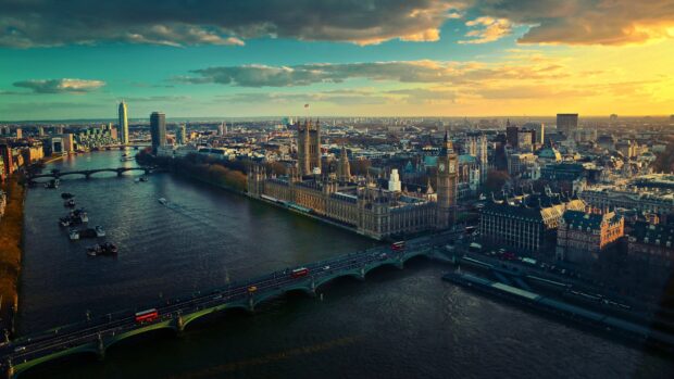 The iconic England architecture along the river with a beautiful sunset sky