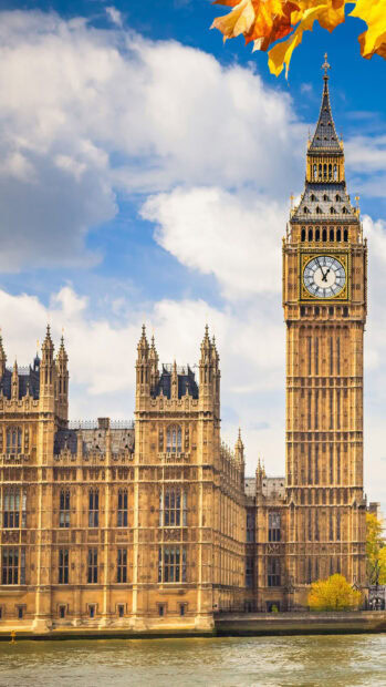 Autumn leaves and London architecture with Big Ben clock tower in England