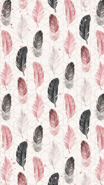 A seamless pattern of soft feathers in muted pink and black tones on a geometric background