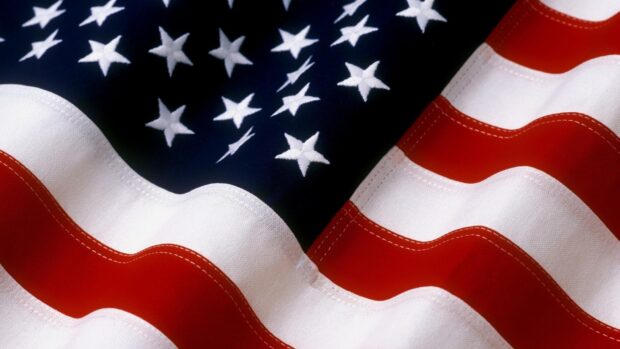 Close up of the United States fabric flag with stars and stripes waving gently