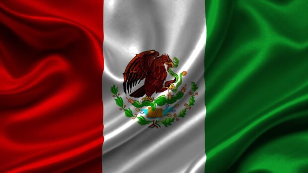 Mexico national flag with eagle and snake emblem on silky fabric background
