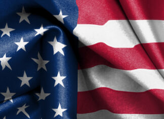 Close up of United States flag fabric texture with stars and stripes