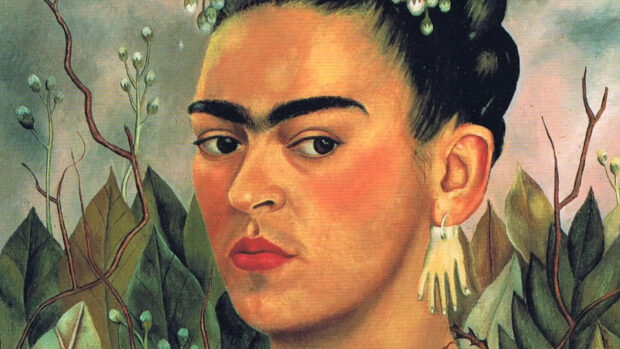 A detailed painting of Frida Kahlo showing her distinctive unibrow and floral background