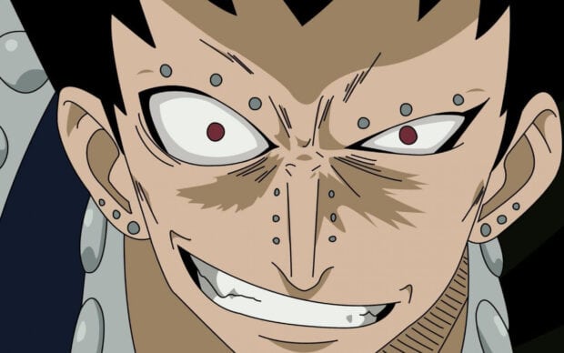 Close up of Gajeel Redfox with piercings and intense eyes in an anime style