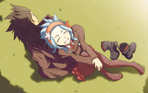Gajeel Redfox lying on grass with a smiling girl sitting beside him