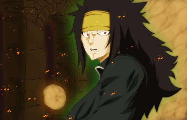 Gajeel Redfox standing with intense expression in a dark fiery background