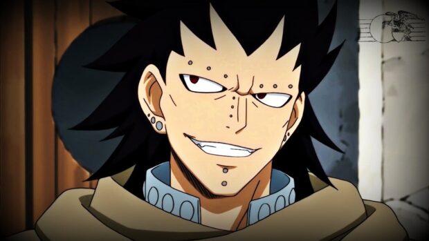 Gajeel Redfox with piercings and spiky black hair smiling confidently