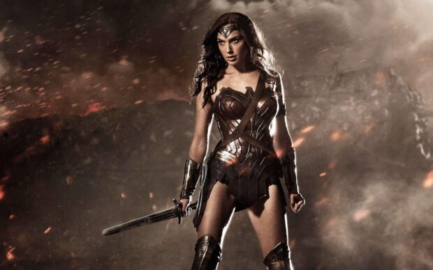 Gal Gadot as a warrior standing confidently with a sword in her hand