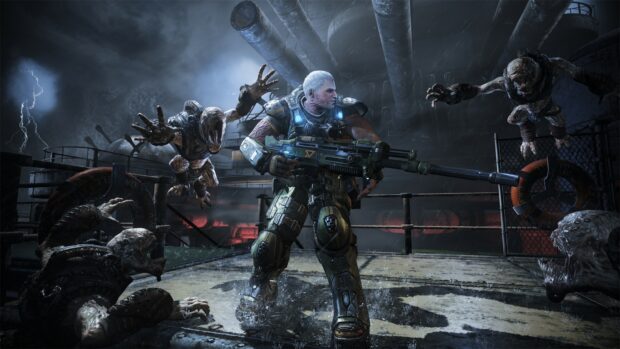 Soldier from Gears of War battling enemies in a dark industrial setting