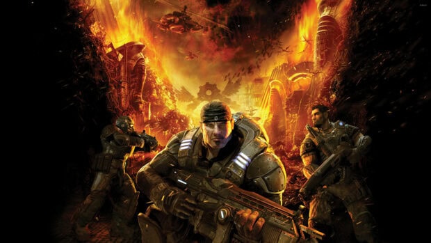 Soldier from Gears of War holding a gun in a fiery battlefield with burning buildings and helicopters