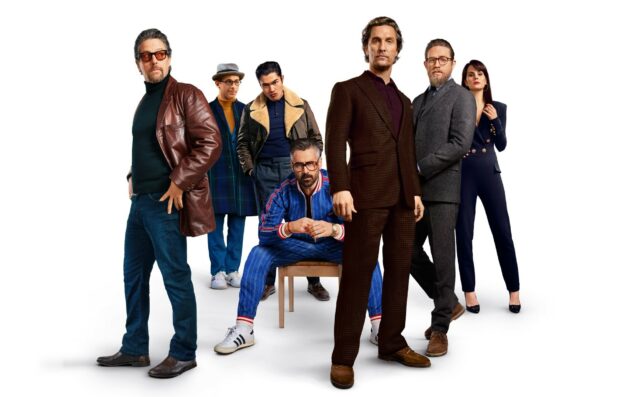 A group of gentlemen displaying stylish fashion in a studio setting