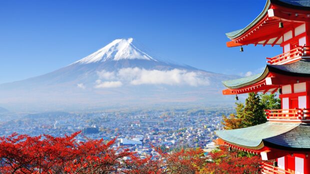 Red autumn foliage with Mount Fuji in the background showing geography features
