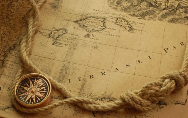 A vintage map showing Mediterranean region with a compass and a thick rope on the side