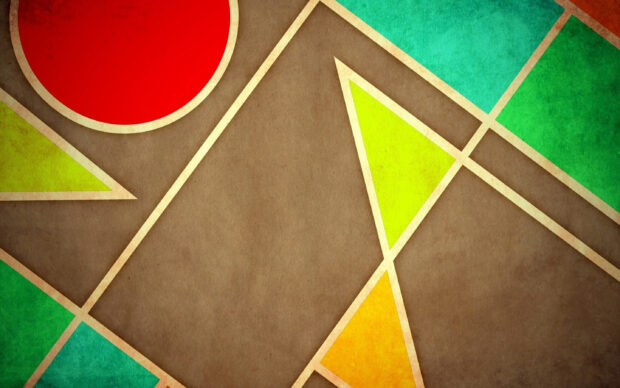 Colorful geometric shapes with triangles circle and rectangles on a brown textured surface