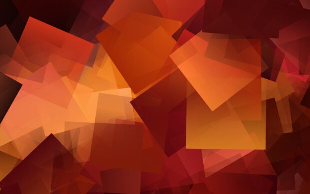 Overlapping geometric shapes create a vibrant pattern of warm colors with reds and oranges