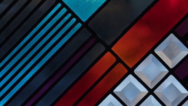Abstract geometric shapes with blue red and purple colors in a clean pattern