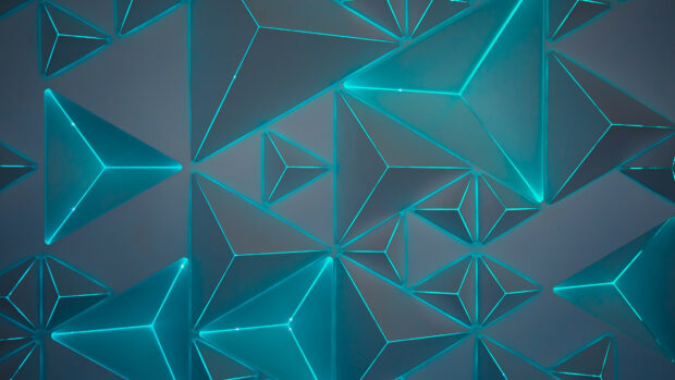 Blue glowing geometry shapes forming a futuristic pattern on a dark surface