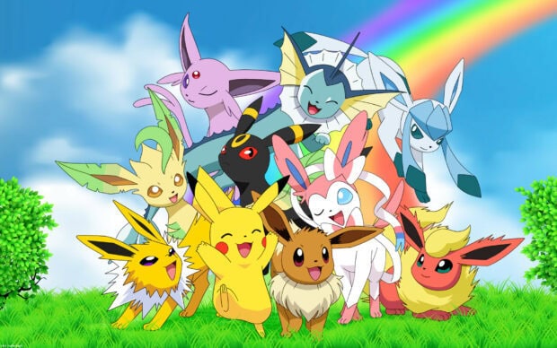 A group of Eeveelutions including Glaceon happily gathered on grass under a rainbow and blue sky