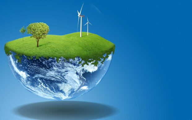 A small floating earth with green grass trees and wind turbines representing go green initiative