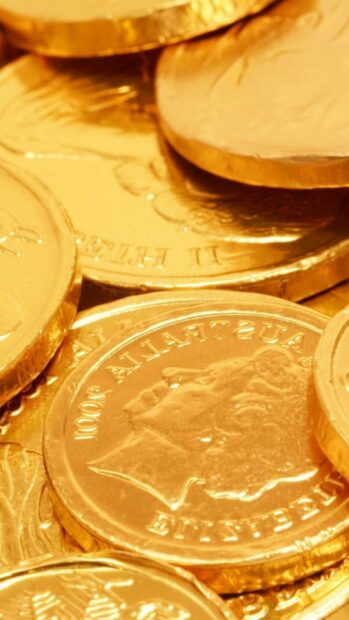 Close up of gold coins with detailed engravings and Australian design