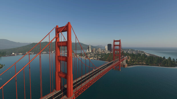 A stunning view of Golden Gate Bridge with the cityscape in the background and clear blue sky