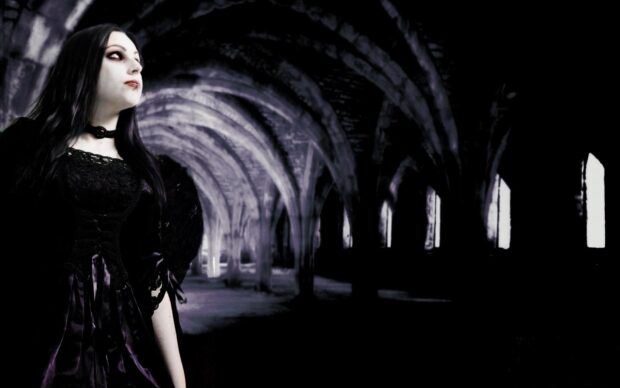 Gothic art woman in dark attire stands inside a gothic arched corridor
