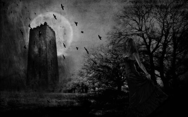 A gothic woman stands near dark trees with a medieval tower and birds flying in the sky