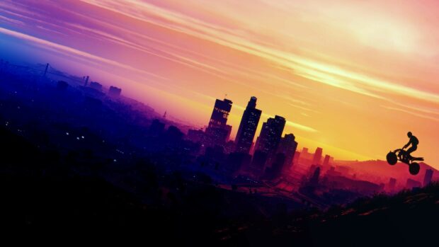 Grand Theft Auto 5 city skyline with a quad bike rider jumping at sunset