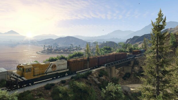 A scenic landscape with a freight train crossing a bridge over a river in Grand Theft Auto 5