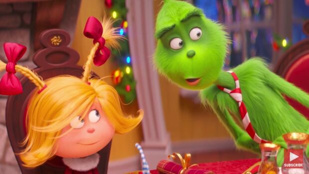 The Grinch and Cindy Lou Who having a conversation in a festive holiday setting