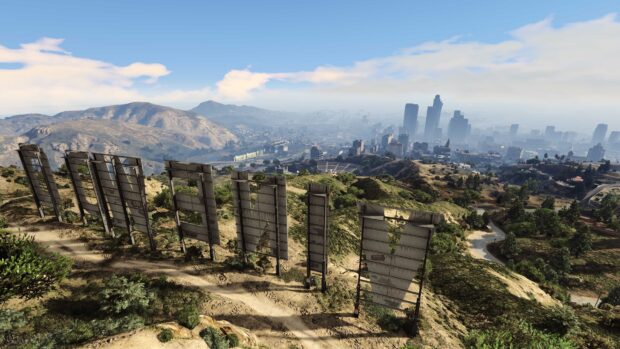 View of the city skyline and hills in gta v with a large sign seen from behind