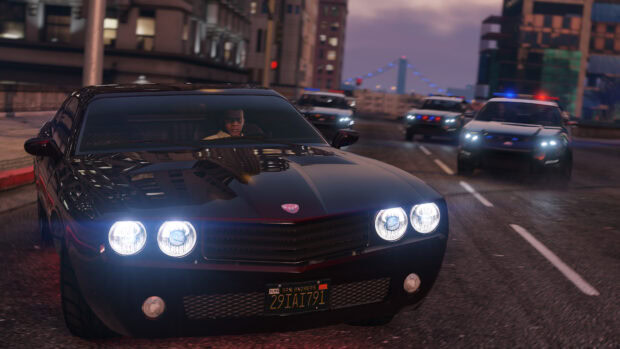 A gta v character driving a black muscle car chased by police vehicles in the city