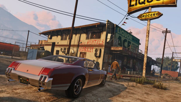 A classic car parked in front of a rural market store with a man walking nearby in gta v