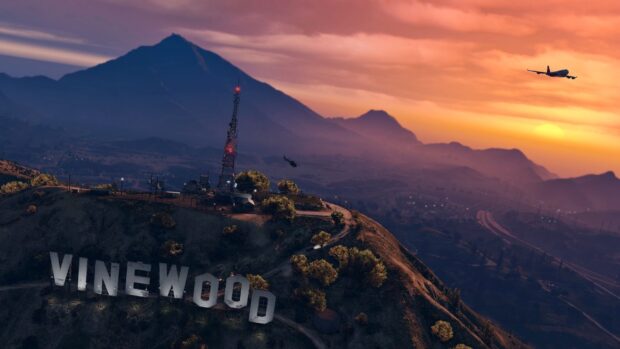 Vinewood hill at sunset in gta v with a plane flying over the landscape