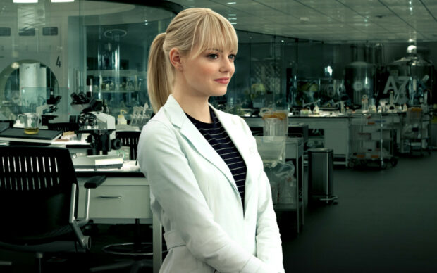Gwen Stacy in a white lab coat standing confidently in a modern laboratory setting