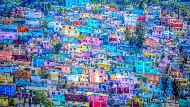 Colorful houses of Haiti stacked on a hillside showcasing Haiti architecture in vibrant colors