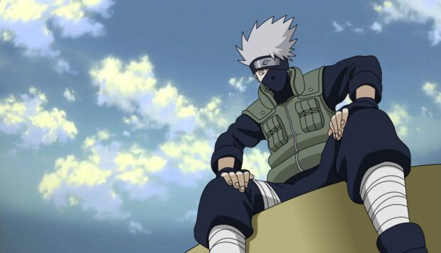 Hatake Kakashi sitting on a ledge wearing his ninja outfit under a blue sky with clouds