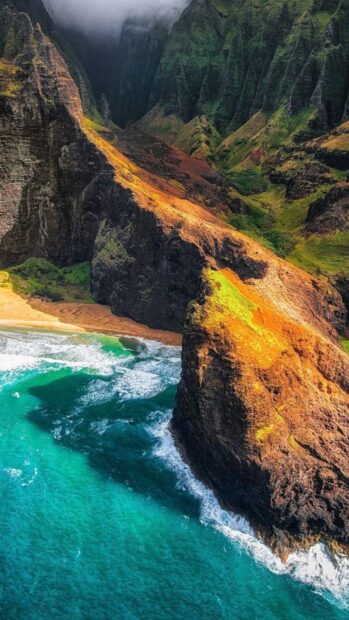 Vibrant volcanic cliffs and lush valleys of Hawaiian ocean coastline