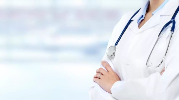 Medical professional wearing a stethoscope and white coat symbolizing health care