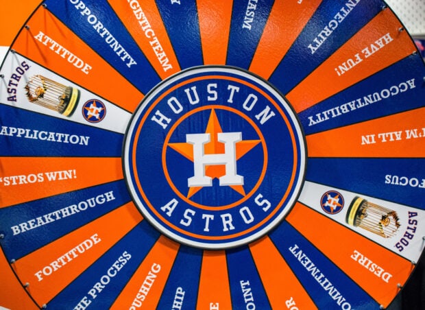A colorful Houston Astros wheel showing team values and trophies in vibrant orange and blue